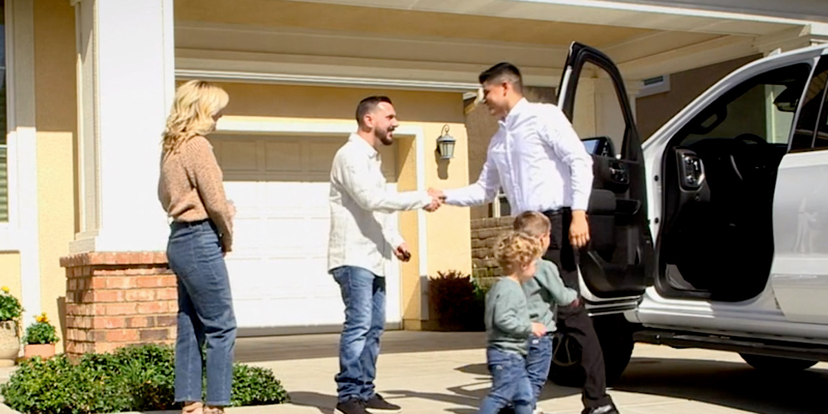handing off car keys to new owner
