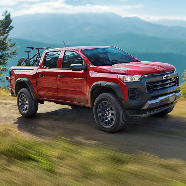 The 2025 Chevy Colorado Driving up a Cliff Side on a Beautiful Day