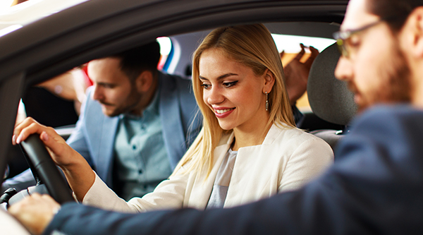 team member guiding shoppers through their car buying experience